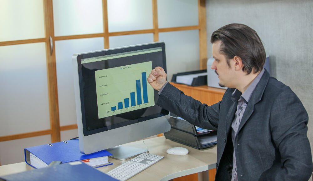 SEO revenue attribution and reporting dashboard on a phone and laptop