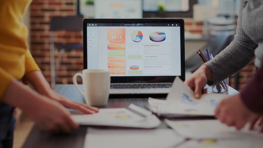 SEO strategist walking a client through the live rankings dashboard