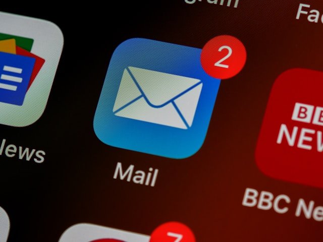 Marketers reviewing email campaign performance together